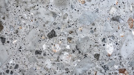 Close up of polished gray terrazzo texture with black and white chips
