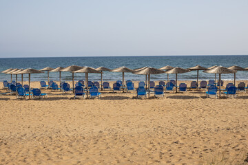 Vacant Beach with Rows of Chairs
