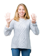 Beautiful young woman wearing winter sweater over isolated background showing and pointing up with...