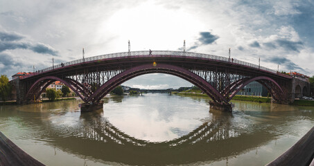 Obraz premium The Old bridge in Maribor city with the river Drava. A panorama view