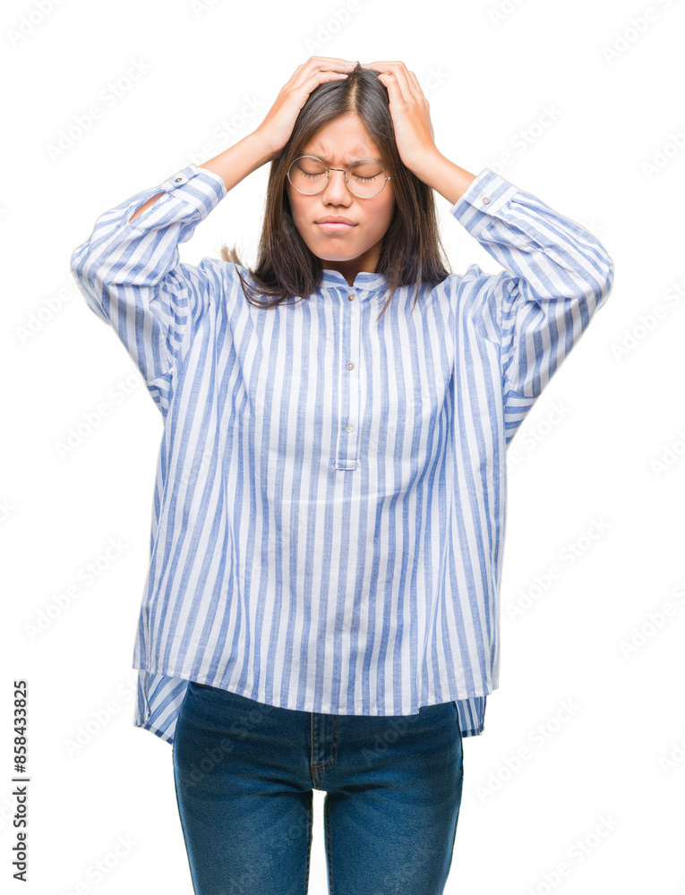 Sticker young asian woman over isolated background suffering from headache desperate and stressed because pa