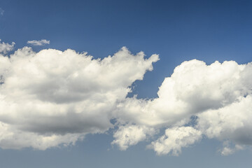 Fluffy White Clouds Against a Blue Sky