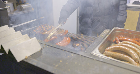 Grilled sausages for sale at winter market