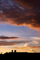 Dramatic sky with orange and dark clouds