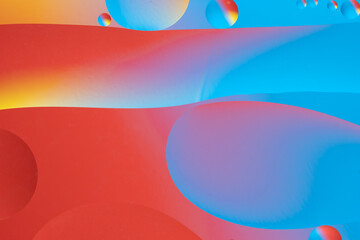 Red and blue abstract design with smooth lines and gradient colors.