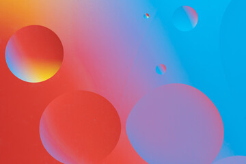 Colorful abstract background with dynamic bubble shapes. Red and blue gradient.