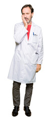 Fototapeta premium Middle age therapist wearing white coat thinking looking tired and bored with depression problems with crossed arms.