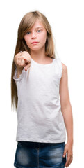 Young blonde toddler pointing with finger to the camera and to you, hand sign, positive and confident gesture from the front