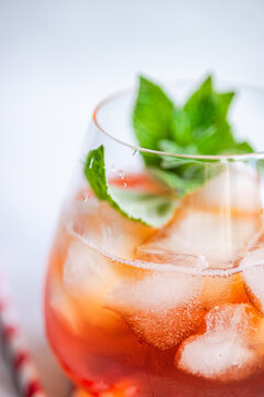 Refreshing Coke cocktail garnished with vibrant mint leaves
