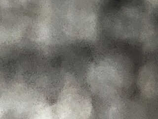 A black and white abstract design taken in a macro photograph distance and cropped into a background design