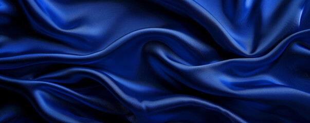Elegant silk fabric background in a rich royal blue with a smooth, flowing texture. The luxurious fabric adds a touch of opulence and sophistication, perfect for high-end or romantic designs