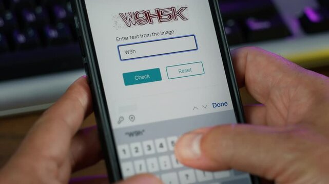 A web user types in a CAPTCHA text box to prove they are not a robot.	