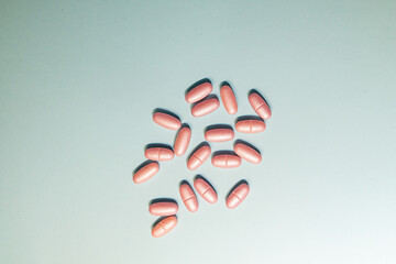 Poured medicines on a blue background.