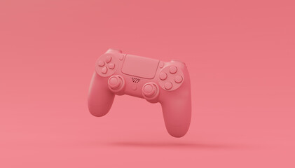 Video game joystick or gamepad in plain monochrome pink color background