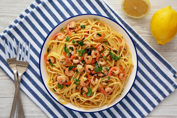 Homemade Garlic Shrimp Scampi with Parsley on a Plate, top view. Flat lay, overhead.