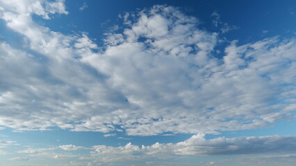 White and blue colors sky and cumulus and cirrocumulus on different layers clouds. Weather was very...