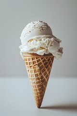 Delectable ice cream cone in a white studio setting a classic frozen dessert treat