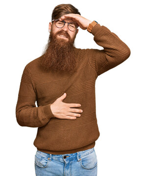Young irish redhead man wearing casual clothes and glasses touching forehead for illness and fever, flu and cold, virus sick