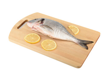 Wooden cutting board with lemon slices and dorado fish ready to cook.