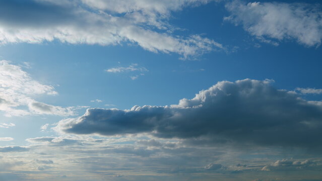Clouds move in the blue sky. Running clouds against the blue sky. Timelapse.