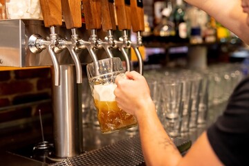 Pouring beer from tap