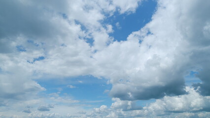 Fluffy layered clouds sky atmosphere. Majestic amazing blue sky with clouds. White and blue colors....