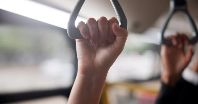 Hands, handle and people in bus for travel, journey or morning city commute together in public transport. Metro, handrail and hustle crowd at a subway for train ride, trip or routine in Hong Kong