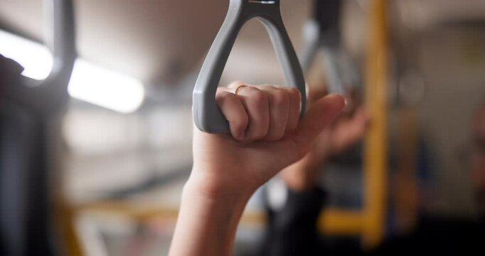Hands, handle and crowd in bus for travel, journey or morning city commute together in public transport. Metro, handrail and people hustle at a subway for train ride, trip or routine in Hong Kong