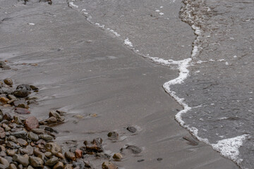 Waiāhole Beach Park，Leeward Coast of Oahu, Honolulu, Hawaii. Waiāhole Stream. Kāneʻohe Bay, is the largest sheltered body of water in the main Hawaiian Islands. Alluvium / Sand and gravel

