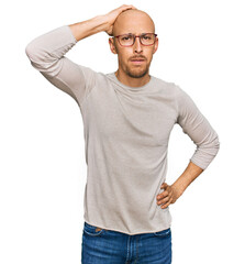 Bald man with beard wearing casual clothes and glasses confuse and wonder about question. uncertain...