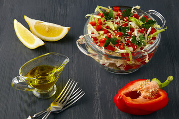 Refreshing summer salad of cabbage and bell pepper with parsley and sesame seeds dressed with lemon...