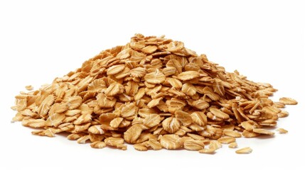 Heap of raw rolled oats on a white background, healthy food and breakfast concept