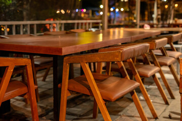 Wooden tables and chairs in a cafe
