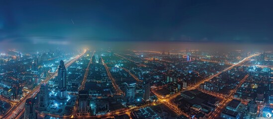 Nighttime Aerial View of a Cityscape with Illuminated Buildings