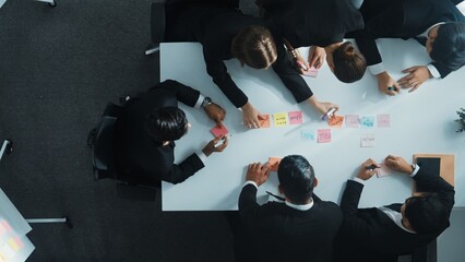 Top down ariel view of professional business team use colorful sticky notes brainstorming idea at...