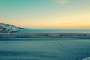 Deserted road and ocean view at sunset