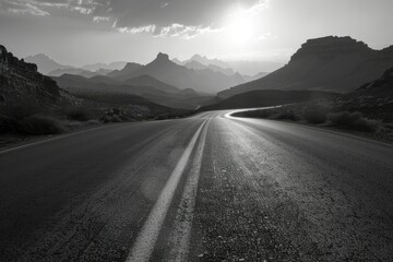 Fototapeta premium Desolate road and mountains at dawn