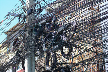 Telephone lines in the capital of Thailand. Unorganized, difficult, confusing