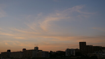 Sunset view from the seaside. The sunset over the city.