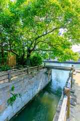 Fototapeta premium 初夏の柳川城堀水門 福岡県柳川市 Yanagawa Castle Moat Water Gate in early summer. Fukuoka Pref, Yanagawa City.