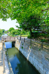 Fototapeta premium 初夏の柳川城堀水門 福岡県柳川市 Yanagawa Castle Moat Water Gate in early summer. Fukuoka Pref, Yanagawa City.