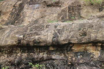 Mountain rock texture. Natural black slate granite slab marble stone ceramic seamless tile rough surface background.