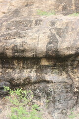 Mountain rock texture. Natural black slate granite slab marble stone ceramic seamless tile rough surface background.