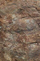 Mountain rock texture. Natural brown slate granite slab marble stone ceramic seamless tile rough surface background.