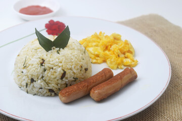 a plate of lime leaf fried rice which is a blend of rice and lime leaves