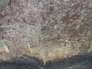 Mountain rock texture. Natural black slate granite slab marble stone ceramic seamless tile rough surface background.