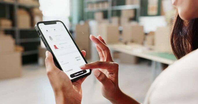 Hand, cellphone screen and online shopping for fashion purchase or shoes, digital app or product. Woman, scroll and shipping courier or virtual stylist in factory with boxes, supply chain or retail