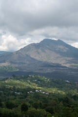 Mt. Batur Volcano Vertical Landscape With Cloudy Skies. Bali, Indonesia. South East Asia