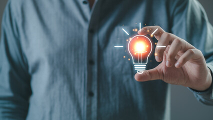 businessman hold light bulb icon inspired by innovative business idea, male boss or director...