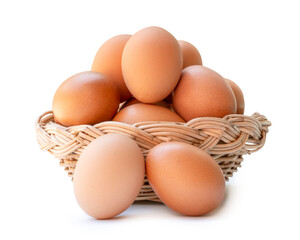 Front view of brown chicken eggs in stack in wicker basket isolated on white background with clipping path